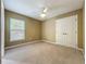 Cozy bedroom with a ceiling fan and a window at 13055 Overstreet Rd, Windermere, FL 34786