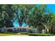 Stone entrance sign for Lakes of Windermere community surrounded by lush landscaping at 13055 Overstreet Rd, Windermere, FL 34786