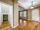 Welcoming entryway with hardwood floors, white door, and stylish chandelier at 13055 Overstreet Rd, Windermere, FL 34786