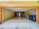Spacious two car garage with sealed floor and plenty of room for storage and access to mechanicals at 13055 Overstreet Rd, Windermere, FL 34786