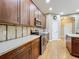 Well-appointed kitchen featuring stainless steel appliances, wooden cabinetry, and modern fixtures at 13055 Overstreet Rd, Windermere, FL 34786