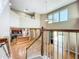 Bright, open-concept living space showcasing hardwood floors, high ceilings, and a glimpse into the modern kitchen at 13055 Overstreet Rd, Windermere, FL 34786