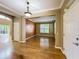 Bright room with hardwood floors, large windows, and an open floor plan at 13055 Overstreet Rd, Windermere, FL 34786