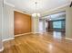 Spacious living area boasts hardwood floors, a neutral color palette, and recessed lighting at 13055 Overstreet Rd, Windermere, FL 34786