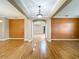 Spacious living room with hardwood floors and neutral paint, perfect for entertaining at 13055 Overstreet Rd, Windermere, FL 34786