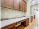 Custom-built office featuring hardwood floors, built-in cabinets, and a spacious desk area at 13055 Overstreet Rd, Windermere, FL 34786