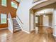 Staircase leads to the upper level with a view to the entryway at 13055 Overstreet Rd, Windermere, FL 34786