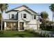 Charming two-story home with large windows, shutters, and a manicured front lawn at 13518 Maria Lavin Circle Rd, Orlando, FL 32828