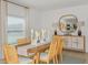 Elegant dining room with a wooden table, stylish chairs, and decorative buffet at 136 Jones Fish Camp Rd, Edgewater, FL 32141