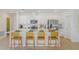 Modern kitchen boasts white cabinetry, a large island with seating, and stainless steel appliances at 136 Jones Fish Camp Rd, Edgewater, FL 32141