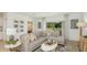 Comfortable living room with a sectional sofa, natural light and stylish décor at 136 Jones Fish Camp Rd, Edgewater, FL 32141