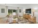 Cozy living room with neutral tones, a comfortable sofa, and plenty of natural light at 136 Jones Fish Camp Rd, Edgewater, FL 32141