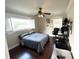 This bedroom features hardwood floors and bright, natural light from the two large windows at 1400 Yates St, Orlando, FL 32804