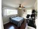 This bedroom features hardwood floors and bright, natural light from the two large windows at 1400 Yates St, Orlando, FL 32804