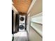 This laundry room includes a stacked washer and dryer unit, with an adjacent exterior door at 1400 Yates St, Orlando, FL 32804
