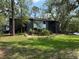 Condo exterior features green spaces, mature trees and easy access to units at 190 Riverbend Dr # 102, Altamonte Springs, FL 32714