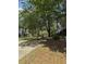 Beautifully landscaped grounds with mature trees and walking paths throughout the community at 190 Riverbend Dr # 102, Altamonte Springs, FL 32714