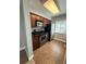 Cozy kitchen features stainless steel appliances, wood cabinets, and tile flooring at 190 Riverbend Dr # 102, Altamonte Springs, FL 32714