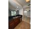 Kitchen with granite countertop, stainless dishwasher, double sink with views to living room at 190 Riverbend Dr # 102, Altamonte Springs, FL 32714