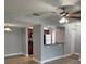 Open concept living area with a ceiling fan and view of kitchen at 190 Riverbend Dr # 102, Altamonte Springs, FL 32714