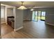 Open-concept space with modern flooring, flows into the kitchen and patio at 190 Riverbend Dr # 102, Altamonte Springs, FL 32714