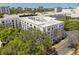 An aerial view showcasing the building's architecture, treetop views, and surrounding urban landscape at 206 E South St # 6007, Orlando, FL 32801