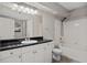 Bathroom featuring vanity with black countertop and modern fixtures and a shower-tub combination at 206 E South St # 6007, Orlando, FL 32801