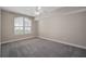 Bedroom featuring neutral walls and carpeting, a ceiling fan, and a window with blinds at 206 E South St # 6007, Orlando, FL 32801
