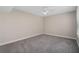 Bedroom featuring neutral walls and carpeting, a ceiling fan, and a window with blinds at 206 E South St # 6007, Orlando, FL 32801