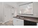 Cozy kitchen with stainless steel sink, modern appliances, and convenient breakfast bar at 206 E South St # 6007, Orlando, FL 32801