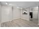 Spacious living room featuring gray-toned wood-look flooring and neutral wall paint at 206 E South St # 6007, Orlando, FL 32801