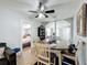 Cozy dining area showcasing a dining table set for four, with an adjacent view of the bedroom at 211 N Randolph Ave, Kissimmee, FL 34741