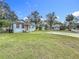 Exterior shot of a home with a large lawn at 211 N Randolph Ave, Kissimmee, FL 34741