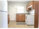 Cozy kitchen featuring tile floors and ample cabinet space at 211 N Randolph Ave, Kissimmee, FL 34741