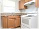 Functional kitchen with updated white appliances and ample cabinet space at 211 N Randolph Ave, Kissimmee, FL 34741