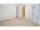 Bright bedroom with plantation shutters, double closet and ensuite bath at 235 Promenade Cir, Lake Mary, FL 32746
