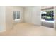 Bright bedroom features plush carpeting, built-in closet, and sliding doors to the outdoor pool area at 235 Promenade Cir, Lake Mary, FL 32746