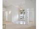 Bright foyer with high ceilings, decorative doors, and marble accents at 235 Promenade Cir, Lake Mary, FL 32746