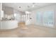 Open living area with seamless access to the kitchen, breakfast nook and rear patio at 235 Promenade Cir, Lake Mary, FL 32746