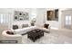 Spacious living room with a large sofa, stylish coffee table, and elegant decor at 235 Promenade Cir, Lake Mary, FL 32746