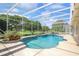 Enjoy a relaxing swim in this screened-in pool with lush landscaping and blue skies above at 235 Promenade Cir, Lake Mary, FL 32746