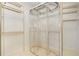 Spacious walk-in closet includes custom shelving and ample storage for clothing and accessories at 235 Promenade Cir, Lake Mary, FL 32746