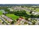 Aerial shot of a property backing onto a golf course and green space in a residential community at 2681 Cabernet Cir, Ocoee, FL 34761