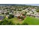 Expansive aerial view of a home in a neighborhood setting, backing onto a lush green space at 2681 Cabernet Cir, Ocoee, FL 34761