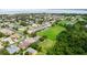 Drone view highlighting the home, the neighborhood and the scenic lake in the background at 2681 Cabernet Cir, Ocoee, FL 34761