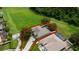 Aerial view showcases home with a large backyard, bordering a sprawling green space and mature trees at 2681 Cabernet Cir, Ocoee, FL 34761
