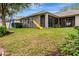 Lush backyard featuring mature trees and a fun playset, perfect for children at 2681 Cabernet Cir, Ocoee, FL 34761