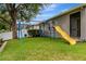 The backyard features a playset, lush green grass, and plenty of space for outdoor activities at 2681 Cabernet Cir, Ocoee, FL 34761