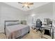 Neutral bedroom features a ceiling fan, carpeted floors, closet, a dresser, and a twin bed at 2681 Cabernet Cir, Ocoee, FL 34761