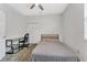 Neutral bedroom features a ceiling fan, carpeted floors, closet, desk, and a twin bed at 2681 Cabernet Cir, Ocoee, FL 34761